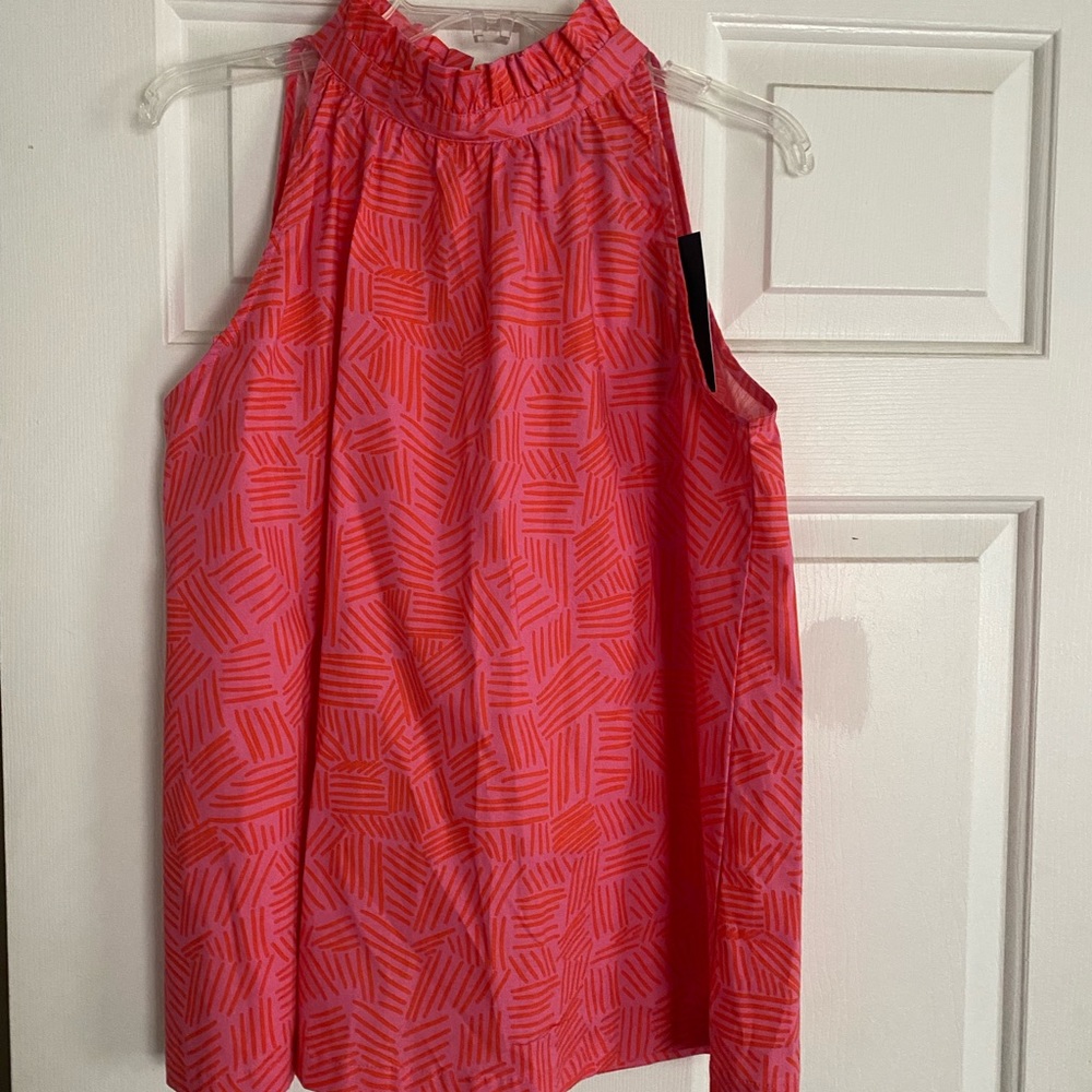 Sleeveless high neck top, button closure on back